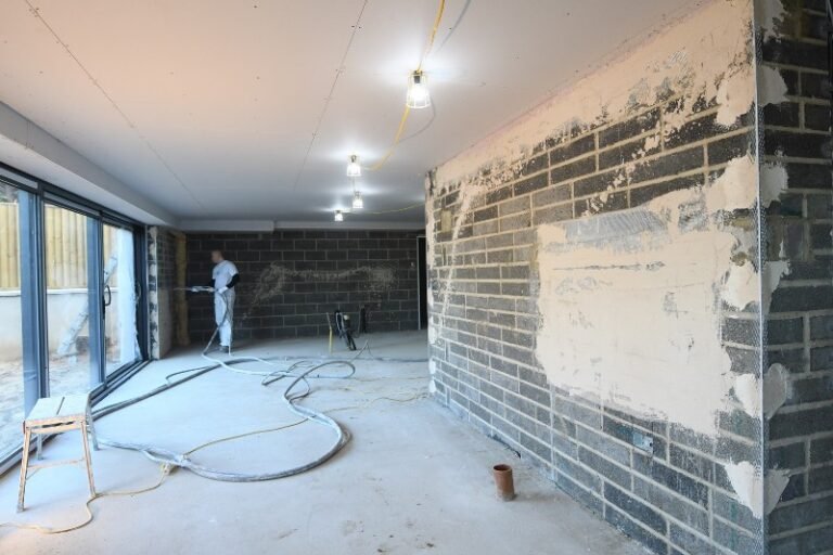 Plastering New Blockwork by spraying machine